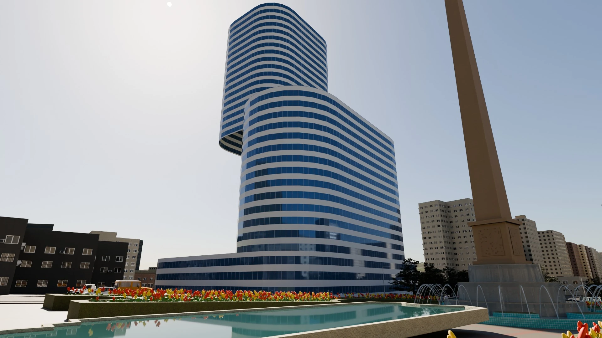 Torre de oficinas junto a la plaza, con jardines y una fuente