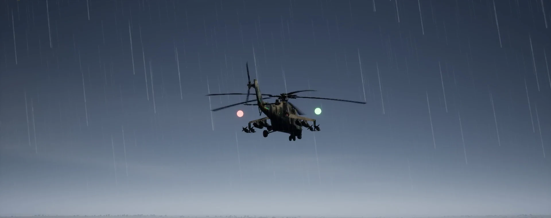 Helicóptero en vuelo bajo la lluvia, visto desde el puesto del tirador